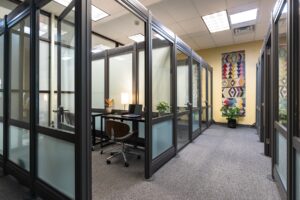 onflume's new office pods are glass divided rooms for individual occupants.