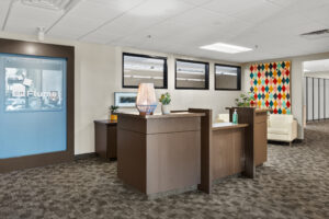 room with brown reception desk